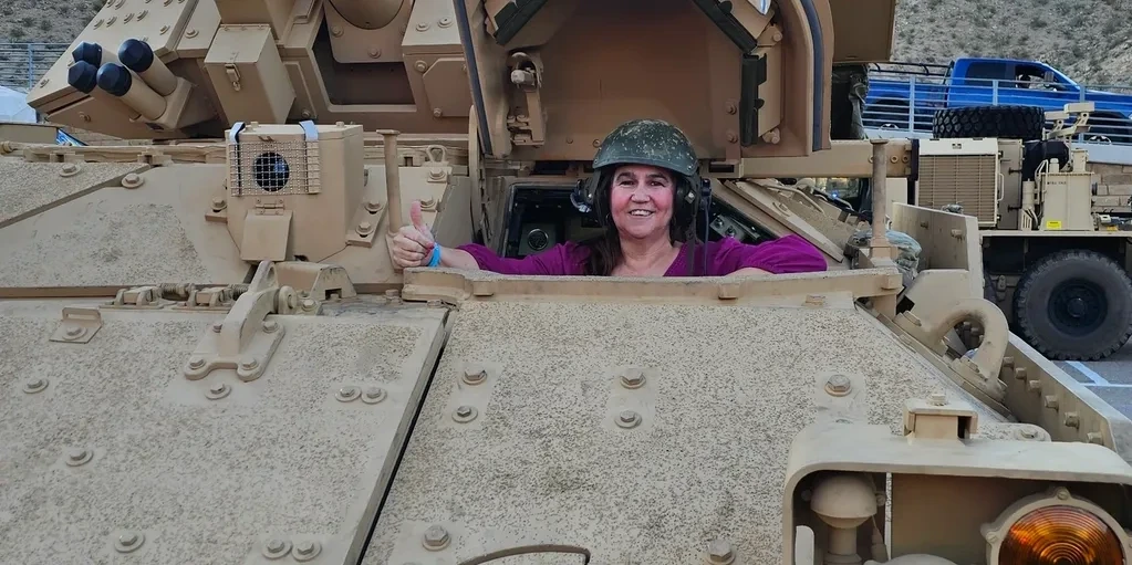 Connie giving a thumbs up — I have a deep respect for the men and women who serve